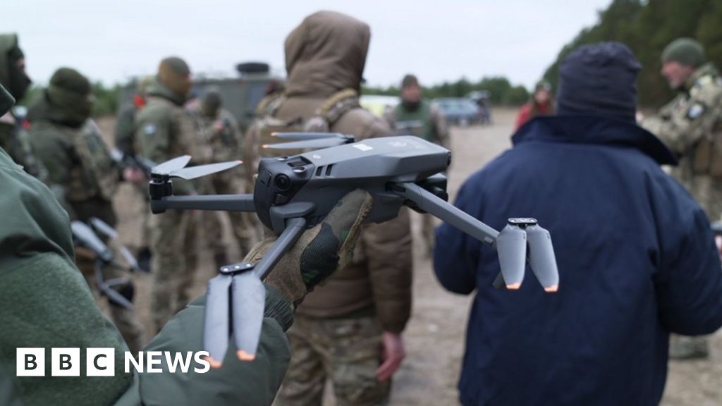 Drone pilots in a dug out