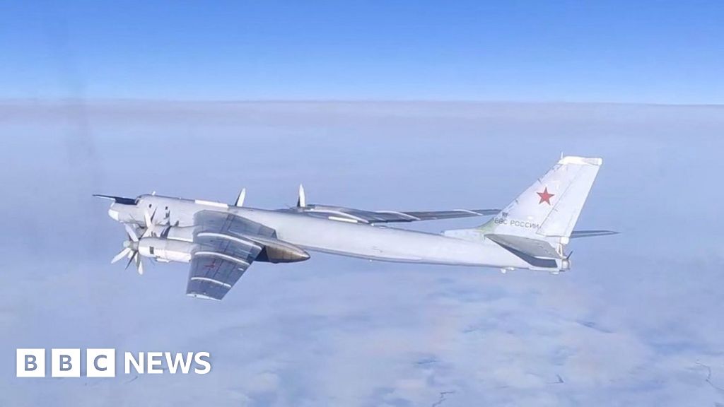 A Russian Tu-95MS strategic bomber performs a flight over the neutral waters of the Bering Sea, in this still image taken from a handout video released February 14, 2023