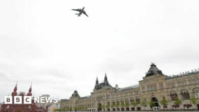A Russian military plane flies over the Kremlin