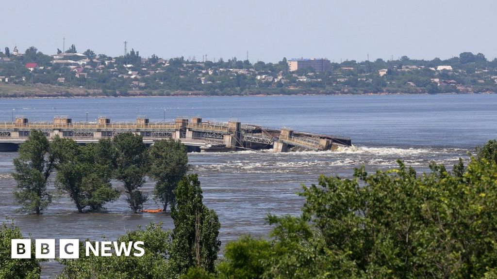 Water gushes over the Kakhovka dam