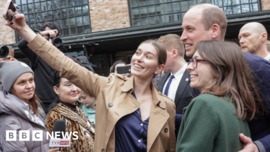 People taking selfies with Prince William