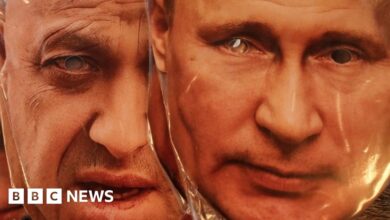 Face masks depicting Wagner chief Yevgeny Prigozhin and Russian President Vladimir Putin displayed for sale at a souvenir market in St. Petersburg, 28 June 2023