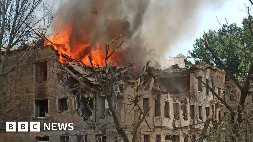 Fire burns out of a damaged building in Dnipro, Ukraine