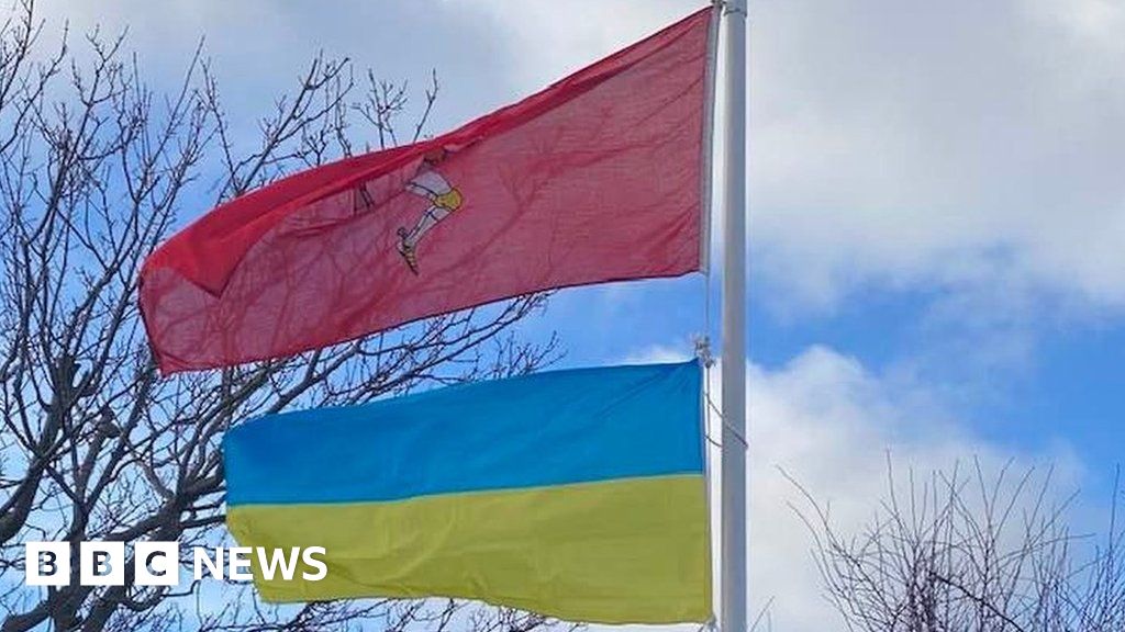 The Isle of Man and Ukrainian flags flying next to each other