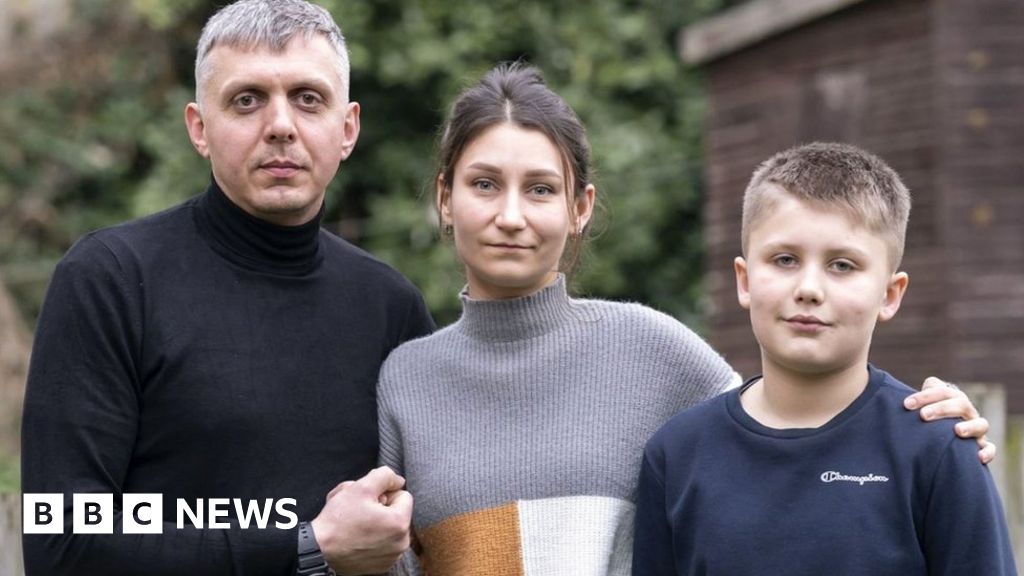 Ukrainian refugees Pavlo Romaniukha (left) with his wife Rymma Parkhomenko-Romaniukha and their son who fled Ukraine,