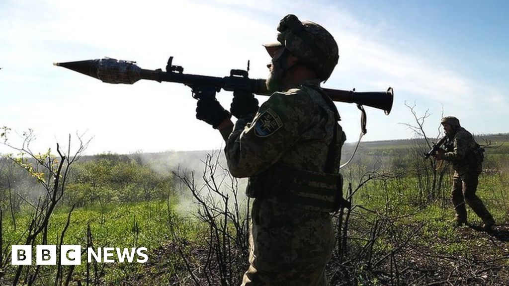 Ukrainian servicemen from the 24th Mechanized Brigade "King Danylo" leave their position after firing a BM-21 "Grad" multiple rocket launcher system (MLRS) in the direction of the frontline city of Bakhmut, at an undisclosed location, Donetsk region, eastern Ukraine, 19 May 2023
