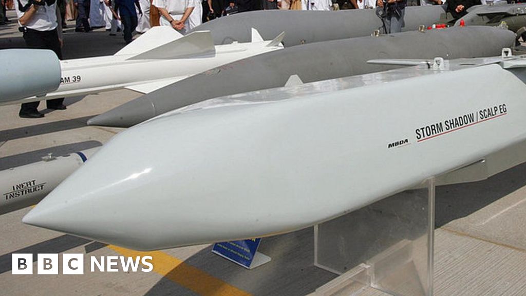 Emirati and foreign visitors pass behind the French made Storm Shadow/Scalp EG cruise missiles at the opening of the five-day Dubai Air Show in Dubai 20 November 2005.