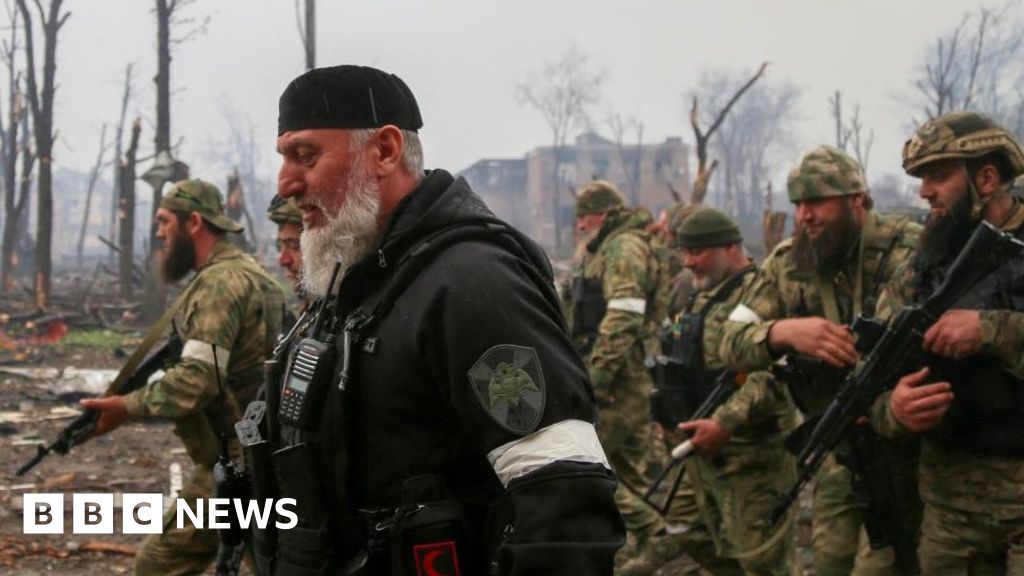 Fighters of the Chechen special forces unit, led by Russia's State Duma member Adam Delimkhanov, walk near the administration building of Azovstal Iron and Steel Works during Ukraine-Russia conflict in the southern port city of Mariupol, Ukraine April 21, 2022