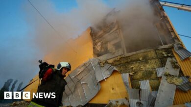 A firefighter works at a site of a tobacco factory damaged during Russian suicide drone strike, amid Russia's attack on Ukraine, in Kyiv, Ukraine May 28, 2023.