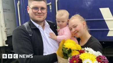 Viktoria, 20, with her young child Eva, on a train to the Ukrainian town of Pokrovsk