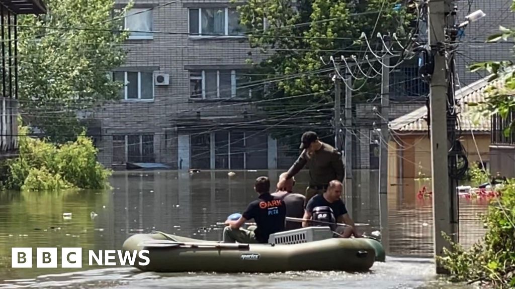 Kherson residents in flooded street