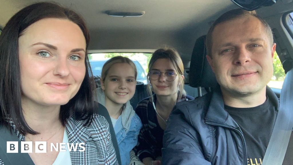 Iryna (left) her husband and daughters Yustyna and Yuiiana