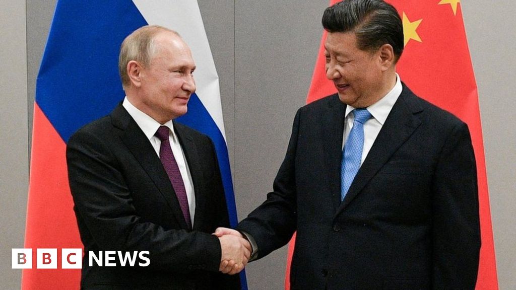 Russian President Vladimir Putin speaks with Chinese President Xi Jinping in Uzbekistan in September 2022